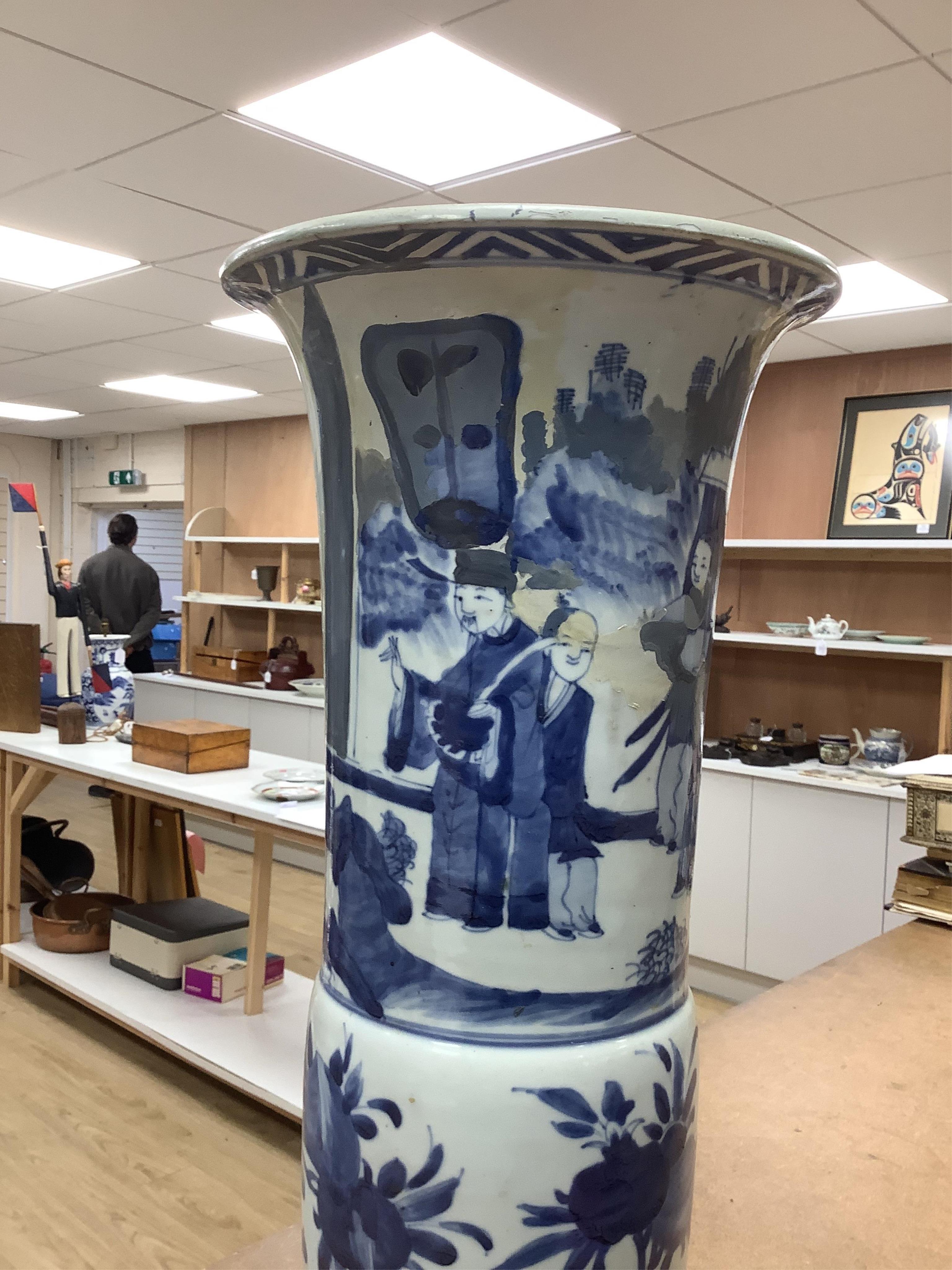 A Chinese blue and white sleeve vase. 53cm high. Condition - heavily restored.